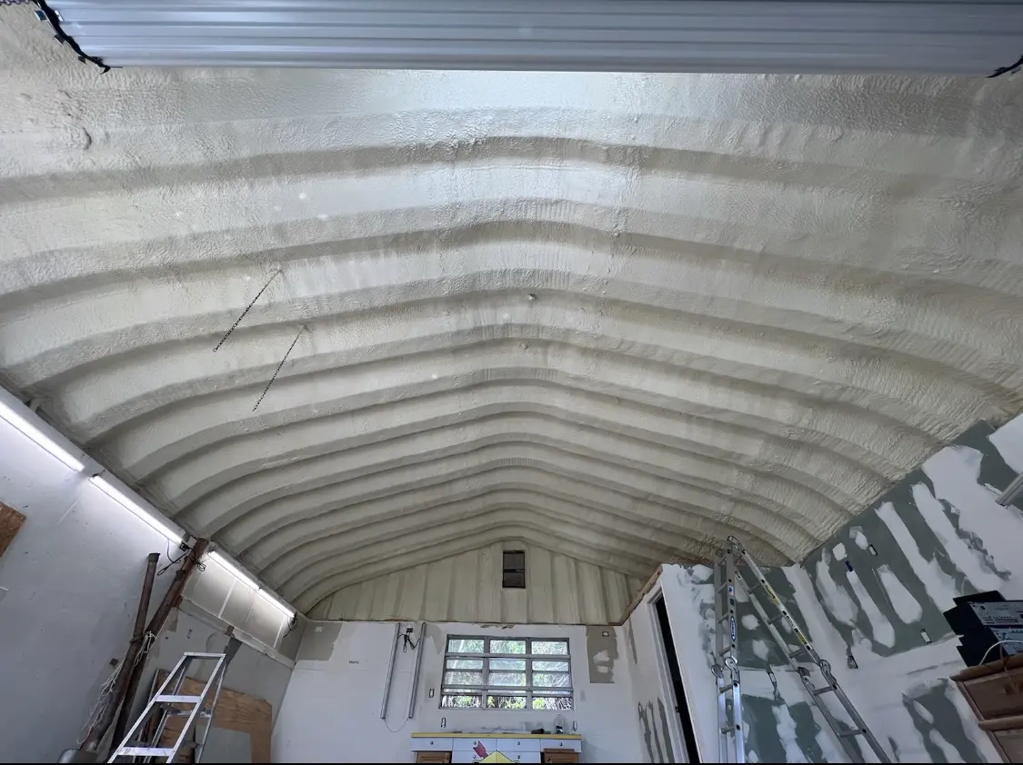 Spray polyurethane foam applied to the underside of a metal roof deck in Rockwood